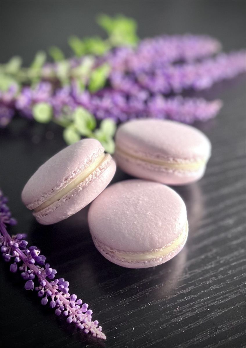 Lavender macarons styled with purple flowers