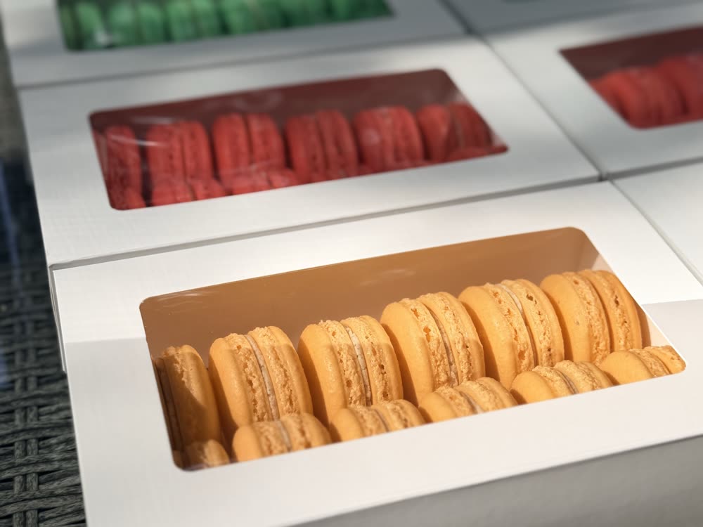 Window boxes of macarons stacked and ready to go out